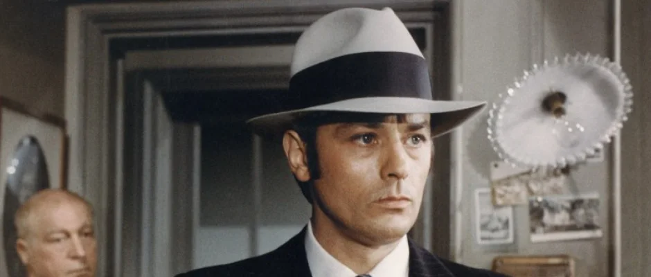 Alain Delon wearing a pale Borsalino fedora in the 1970 film Borsalino.